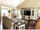Cozy living room featuring hardwood floors and a large entertainment center at 9614 Indigo Creek Blvd., Murrells Inlet, SC 29576