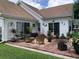 Outdoor patio featuring brick pavers, comfortable seating, and mature plants at 9614 Indigo Creek Blvd., Murrells Inlet, SC 29576