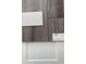 Close up of luxury vinyl flooring and white countertop sample for a modern interior design at 982 Oak Hollow St., Longs, SC 29568