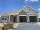 New construction home showing the facade, front yard in progress and the future two-car garage at 985 Oak Hollow St., Longs, SC 29568