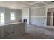 Living room featuring a fireplace, large windows and an open concept into the kitchen at 985 Oak Hollow St., Longs, SC 29568