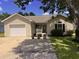Charming single-story home featuring a one-car garage and a landscaped front yard at 9888 Conifer Ln., Murrells Inlet, SC 29576