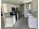 Updated kitchen featuring white cabinets, granite countertops, and stainless steel appliances at 9888 Conifer Ln., Murrells Inlet, SC 29576