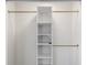Walk-in closet with white shelving and gold closet rods for optimal organization at 1008 Plantation Dr., Surfside Beach, SC 29575