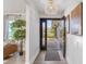 Welcoming entryway with wood floors, contemporary decor, and a front door with glass panels at 1008 Plantation Dr., Surfside Beach, SC 29575