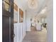 Bright entryway with light wood floors, wainscoting, and views into the kitchen at 1008 Plantation Dr., Surfside Beach, SC 29575