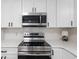 Close up of a kitchen featuring stainless steel appliances, white countertops, and modern cabinetry at 1008 Plantation Dr., Surfside Beach, SC 29575