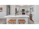 Bright kitchen featuring an island with seating, modern appliances, and stylish white cabinetry at 1008 Plantation Dr., Surfside Beach, SC 29575
