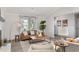 Bright living room featuring stylish furniture, decor, and large windows with lots of natural light at 1008 Plantation Dr., Surfside Beach, SC 29575