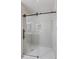 Modern shower with glass doors and white subway tile at 1008 Plantation Dr., Surfside Beach, SC 29575