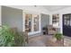 Sunroom with brick accent wall that leads into the house via glass paneled doors at 1008 Plantation Dr., Surfside Beach, SC 29575