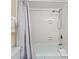 Bright bathroom featuring a tiled shower and tub combo with a shower curtain for added privacy at 10200 Beach Club Dr. # 16F, Myrtle Beach, SC 29572