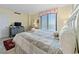 The bedroom features a neutral palette, soft bedding, and a full-sized window for ample natural light at 10200 Beach Club Dr. # 16F, Myrtle Beach, SC 29572