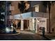 Night view of the elegant entrance to Arcadian I, featuring covered portico and decorative landscaping at 10200 Beach Club Dr. # 16F, Myrtle Beach, SC 29572