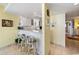 Bright kitchen with a breakfast bar and white cabinets for ample storage at 10200 Beach Club Dr. # 16F, Myrtle Beach, SC 29572