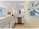 Modern kitchen featuring white cabinets, stainless steel appliances, and a breakfast bar at 10200 Beach Club Dr. # 16F, Myrtle Beach, SC 29572