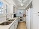 Galley kitchen with white cabinets, stainless steel appliances, and ample counter space at 10200 Beach Club Dr. # 16F, Myrtle Beach, SC 29572