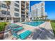 Exterior shot of the sparkling community pool with lounge chairs and lush landscaping at 10200 Beach Club Dr. # 16F, Myrtle Beach, SC 29572