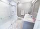 Modern bathroom with a frameless glass shower, marble tile surround, and dual sink vanity at 1150 Waterway Dr., Myrtle Beach, SC 29572