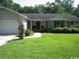 Charming single-story home with a well-manicured lawn and traditional architectural details at 1150 Waterway Dr., Myrtle Beach, SC 29572