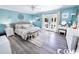 Bright main bedroom with access to private patio, featuring cool toned walls and floors at 1150 Waterway Dr., Myrtle Beach, SC 29572