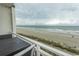 Balcony view overlooking the beach, showcasing the ocean and sandy shore at 1207 S Ocean Blvd. # 20403, Myrtle Beach, SC 29577