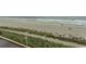 Beach access view, sandy shores meeting calm waves, showcasing the proximity to the ocean at 1207 S Ocean Blvd. # 20403, Myrtle Beach, SC 29577