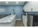 Kitchen with white cabinets, marble countertops, and stainless steel appliances at 1207 S Ocean Blvd. # 20403, Myrtle Beach, SC 29577