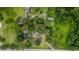Aerial perspective showcases a home nestled within vibrant greenery and mature trees, offering privacy and natural beauty at 1217 S Highway 501, Marion, SC 29571