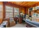 Wood-paneled study or bedroom features natural light, workspace, and cozy ambiance, ideal for focus and relaxation at 1217 S Highway 501, Marion, SC 29571