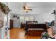 Cozy bedroom features natural light, a ceiling fan, and a glimpse of organized decor, creating a serene atmosphere at 1217 S Highway 501, Marion, SC 29571