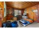 Traditional wood-paneled bedroom boasts ample natural light, storage, and cozy ambiance for relaxed living at 1217 S Highway 501, Marion, SC 29571
