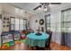 Comfortable dining area with blue tablecloth, laminate floors, and a view to the outdoors at 1217 S Highway 501, Marion, SC 29571