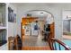 An arched entryway provides views into kitchen and breakfast nook, with wood cabinets at 1217 S Highway 501, Marion, SC 29571