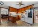 Functional kitchen with wood cabinets, white appliances, and vinyl flooring at 1217 S Highway 501, Marion, SC 29571