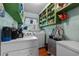 Practical laundry room with ample shelving, washer, dryer, and natural light at 1217 S Highway 501, Marion, SC 29571