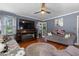Inviting living room featuring hardwood floors, a fireplace, and comfortable seating, creating a cozy atmosphere at 1217 S Highway 501, Marion, SC 29571