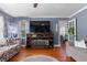 Inviting living room with a decorative fireplace, hardwood floors, and ample seating at 1217 S Highway 501, Marion, SC 29571