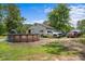 Property features an outbuilding with an above-ground pool, multiple vehicles parked outside and ample space at 1217 S Highway 501, Marion, SC 29571