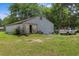 Outbuilding offers open door access and a spacious interior filled with items, and truck parking on the lawn at 1217 S Highway 501, Marion, SC 29571