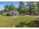 Property featuring an outbuilding, the house, and a pool enhancing the outdoor recreational options and storage at 1217 S Highway 501, Marion, SC 29571