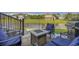 Cozy backyard patio with fire pit and comfortable seating, ideal for outdoor gatherings near pond at 1323 Ashboro Ct., Myrtle Beach, SC 29579