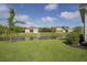 Beautiful backyard view featuring a serene pond and lush landscaping, offering privacy and tranquility at 1323 Ashboro Ct., Myrtle Beach, SC 29579