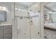 Bathroom featuring an updated shower with glass doors, tile, and a modern shower head at 1323 Ashboro Ct., Myrtle Beach, SC 29579