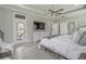 Large bedroom with light wood floors, an exit door, and a view of the exterior at 1323 Ashboro Ct., Myrtle Beach, SC 29579