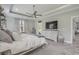 Spacious bedroom showcasing light wood floors, a ceiling fan, and a decorative dresser at 1323 Ashboro Ct., Myrtle Beach, SC 29579