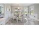 Bright breakfast nook with serene views and access to the outdoors, perfect for morning coffee at 1323 Ashboro Ct., Myrtle Beach, SC 29579