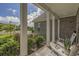Relaxing front porch area with views of lush landscaping and comfortable seating at 1323 Ashboro Ct., Myrtle Beach, SC 29579