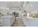 Elegant white kitchen featuring an island with seating and stainless steel appliances at 1323 Ashboro Ct., Myrtle Beach, SC 29579