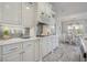 Charming kitchen features custom cabinetry, stainless appliances, and a stylish breakfast nook at 1323 Ashboro Ct., Myrtle Beach, SC 29579